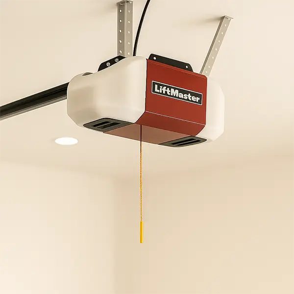 Ceiling-mounted LiftMaster garage door opener with yellow emergency release cord in a modern residential garage